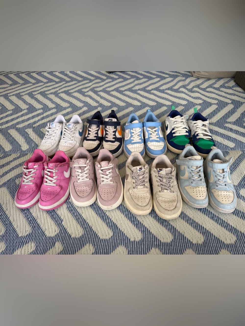 8 pairs of preowned kids Nike sneakers